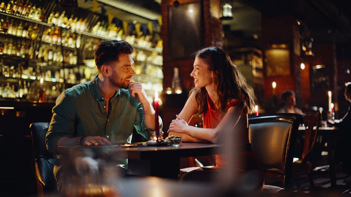 Couple enjoying drinks at Taboo's modern luxury bar